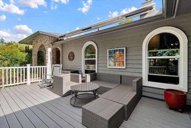 wooden deck featuring outdoor lounge area