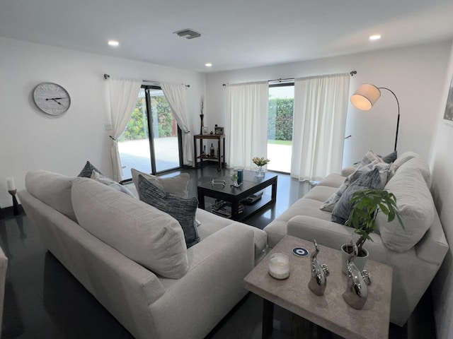 living room with visible vents and recessed lighting