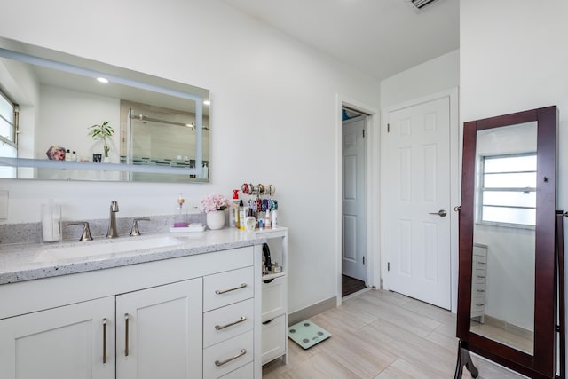 full bathroom with visible vents and vanity