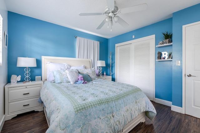 bedroom featuring a closet, baseboards, ceiling fan, and dark wood-style flooring