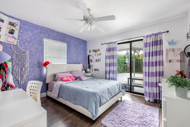 bedroom featuring a textured ceiling, a ceiling fan, access to exterior, dark wood-style floors, and wallpapered walls