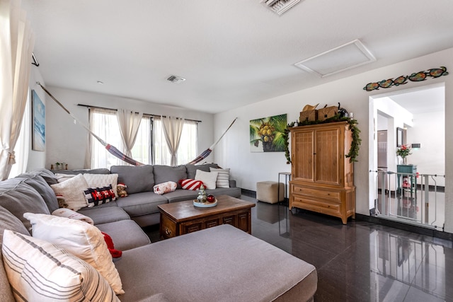 living room with attic access and visible vents