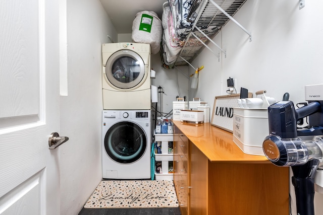 washroom with laundry area and stacked washer / dryer