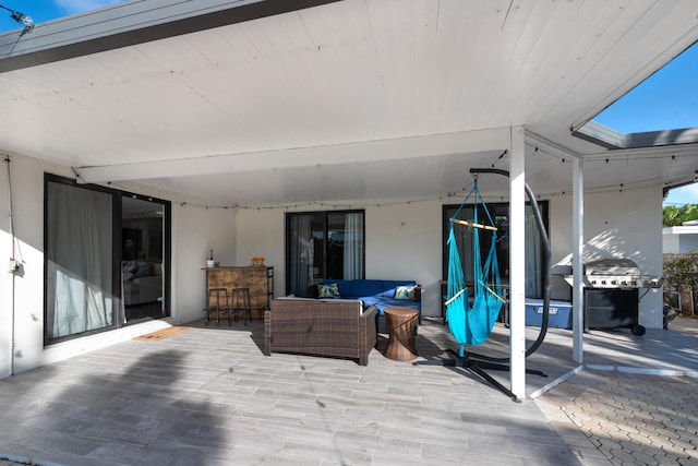 view of patio / terrace with outdoor dry bar, grilling area, and an outdoor hangout area