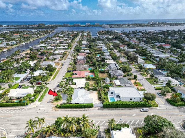 bird's eye view featuring a water view and a residential view