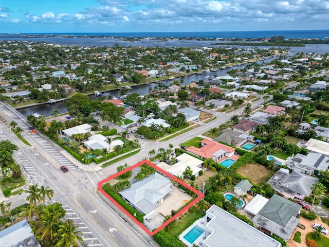 bird's eye view with a water view and a residential view