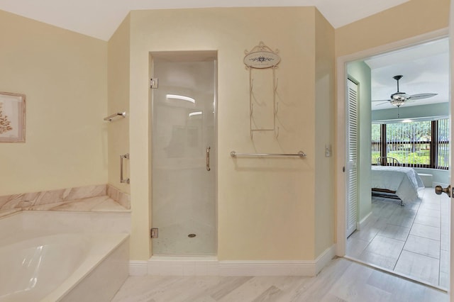 bathroom with independent shower and bath and ceiling fan