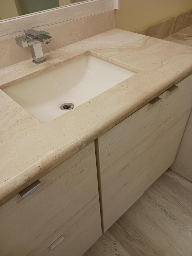 bathroom featuring vanity and hardwood / wood-style floors