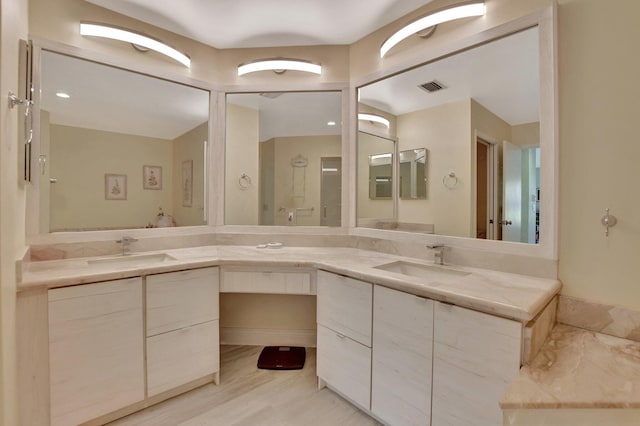 bathroom featuring vanity and hardwood / wood-style floors