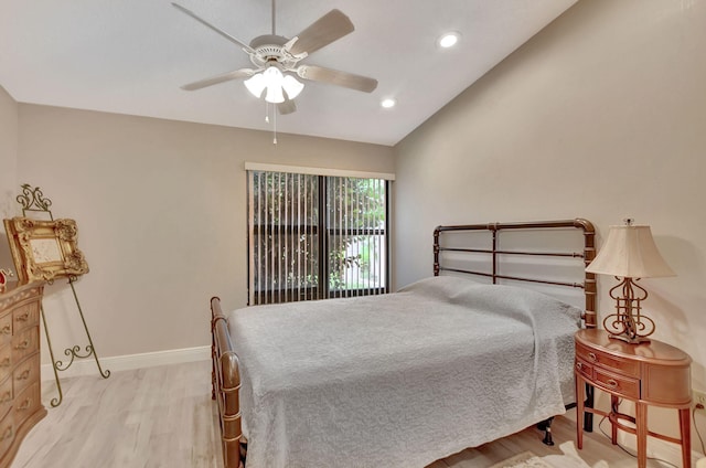 bedroom featuring light hardwood / wood-style floors, ceiling fan, and lofted ceiling