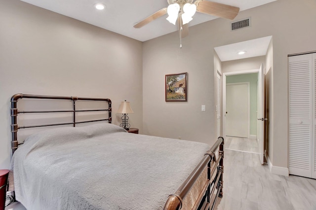 bedroom featuring light wood-type flooring, a closet, and ceiling fan