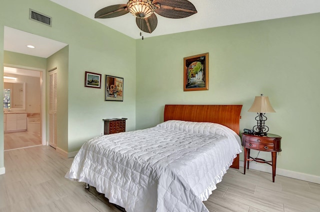 bedroom with connected bathroom, ceiling fan, and a closet