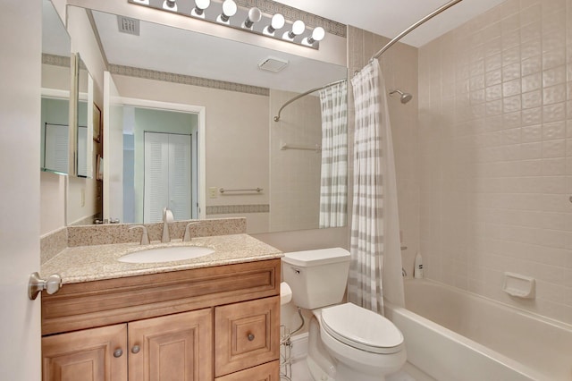 full bathroom with vanity, toilet, and shower / bath combo with shower curtain