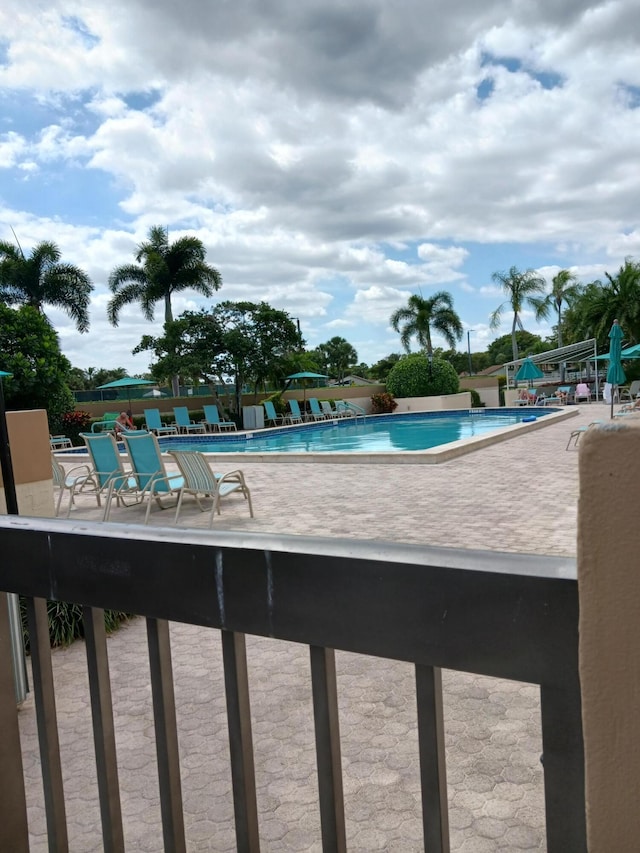 view of pool featuring a patio