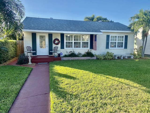 ranch-style home with a front yard