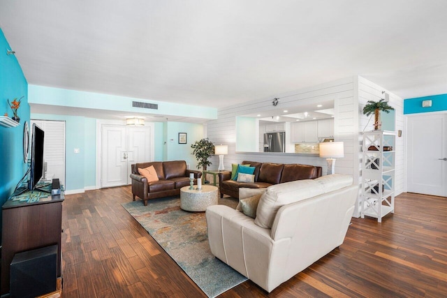 living room with dark hardwood / wood-style floors