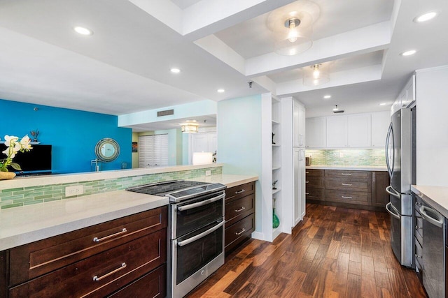 kitchen with dark hardwood / wood-style flooring, tasteful backsplash, dark brown cabinets, stainless steel appliances, and white cabinets