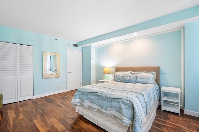 bedroom with dark wood-type flooring