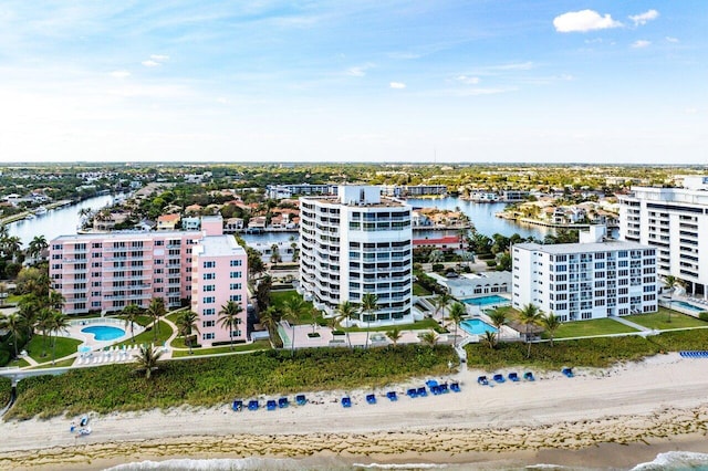 drone / aerial view featuring a view of the beach and a water view