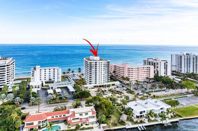 birds eye view of property with a water view