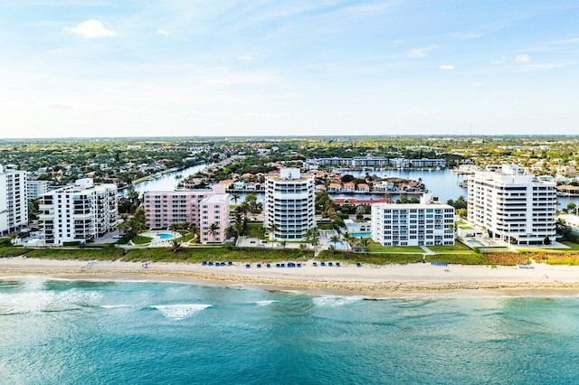 drone / aerial view featuring a view of the beach and a water view