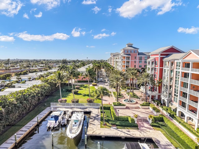 view of property's community with a boat dock and a water view