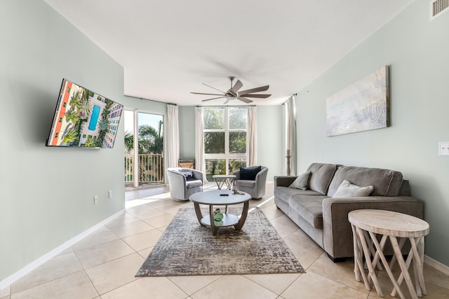 living room featuring ceiling fan and light tile patterned flooring