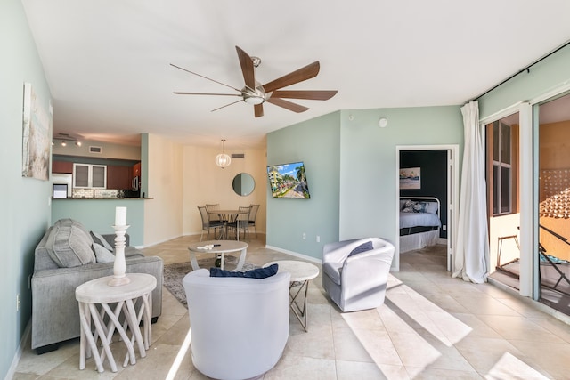 living room with light tile patterned floors and ceiling fan