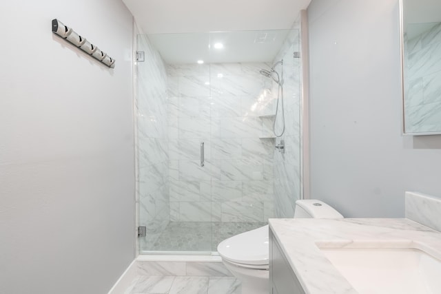 bathroom with vanity, toilet, and a shower with shower door