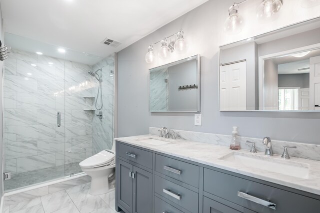 bathroom featuring vanity, toilet, and walk in shower