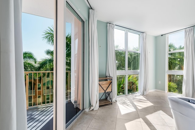 entryway featuring light tile patterned floors and expansive windows