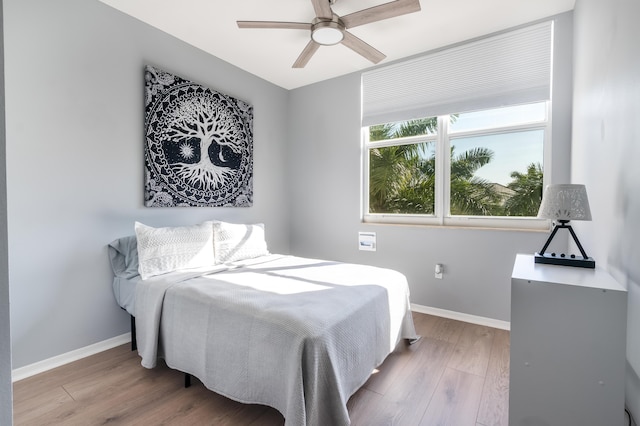 bedroom featuring light hardwood / wood-style floors and ceiling fan