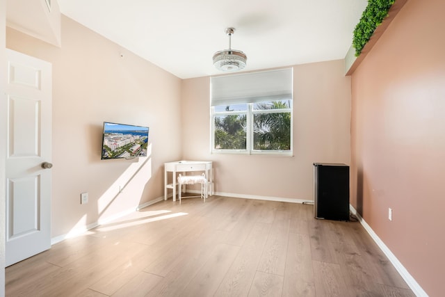 spare room featuring light wood-type flooring