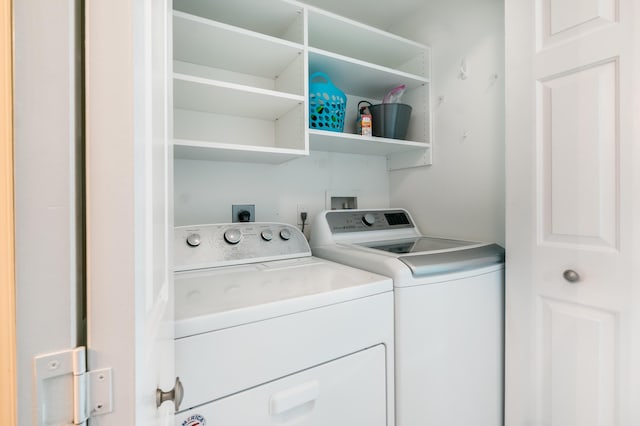 laundry room with washer and dryer