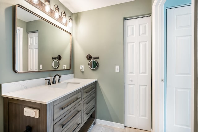 bathroom with tile patterned flooring and vanity