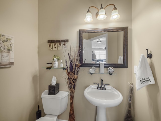 bathroom with toilet and sink