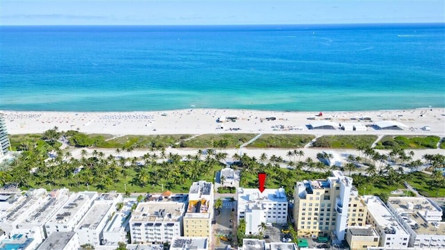 bird's eye view featuring a beach view and a water view