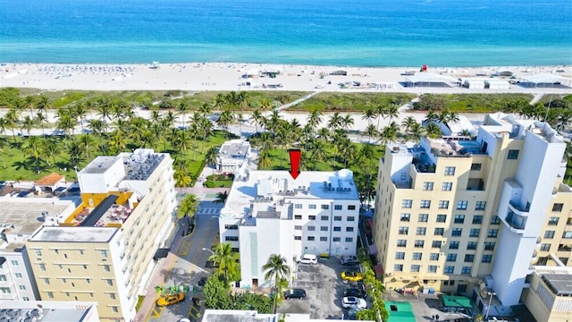 aerial view with a water view and a view of the beach