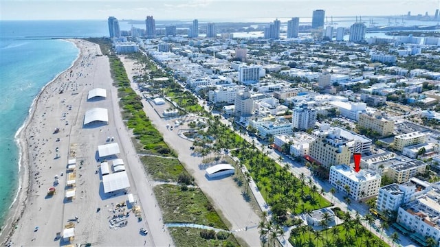 bird's eye view featuring a water view and a view of the beach