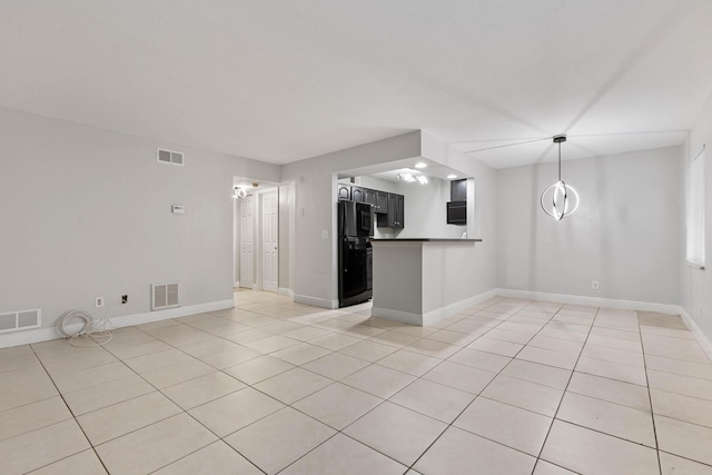 unfurnished living room featuring light tile patterned floors