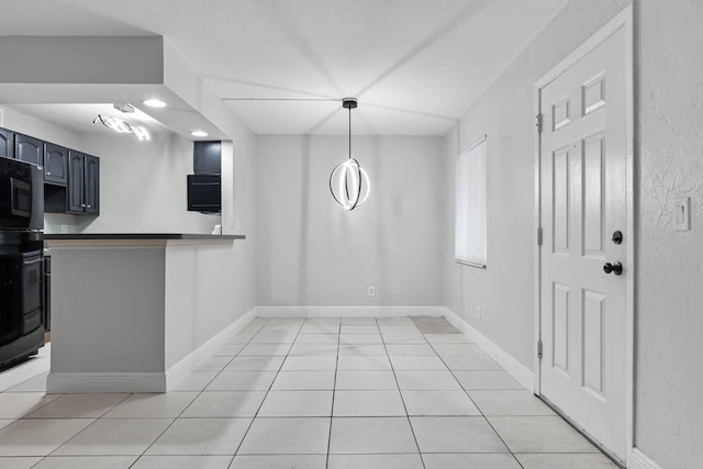 unfurnished dining area featuring light tile patterned floors