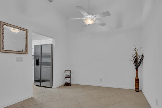 unfurnished room featuring ceiling fan and light tile patterned flooring