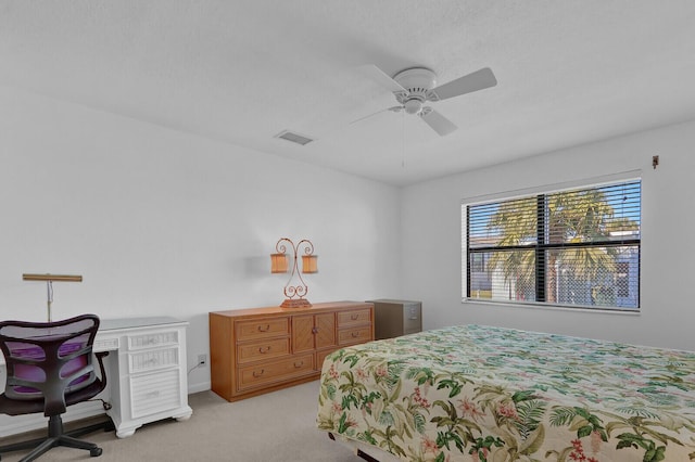 bedroom with ceiling fan and light colored carpet