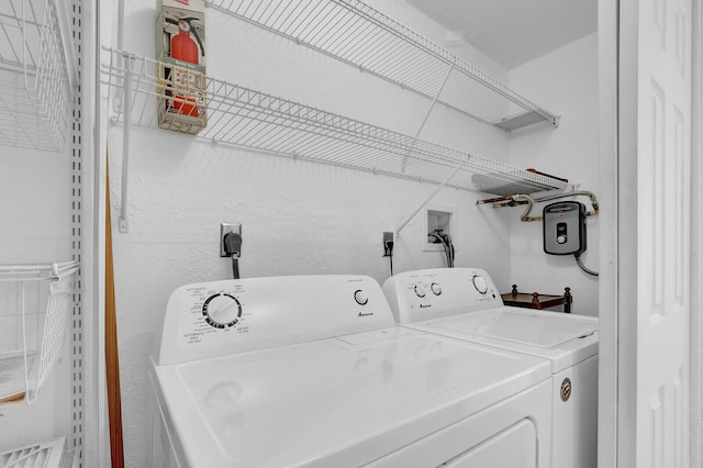 laundry area featuring washing machine and clothes dryer