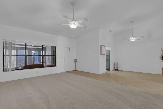 unfurnished living room featuring ceiling fan and light tile patterned flooring