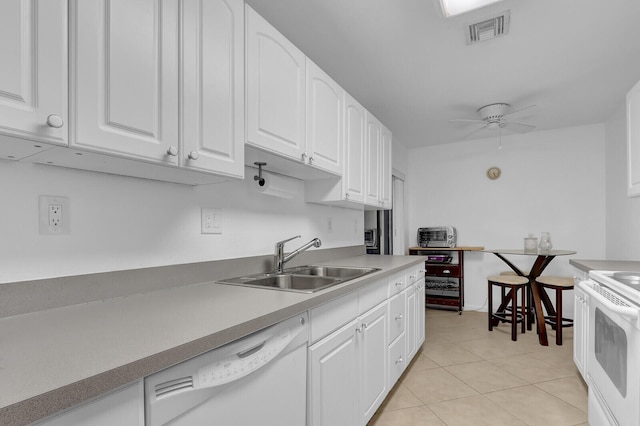 kitchen with white appliances, white cabinets, sink, ceiling fan, and light tile patterned floors