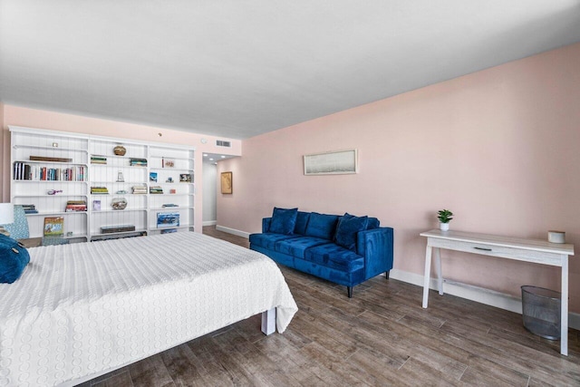 bedroom featuring dark wood-type flooring