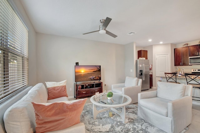 living room featuring ceiling fan