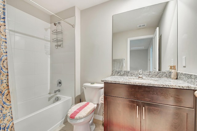 full bathroom featuring tile patterned flooring, vanity, shower / bath combo, and toilet