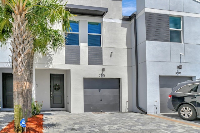 view of front of property with a garage